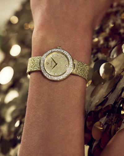 Lady's Gold-Tone Bulova "Crystal" with Champagne Dial and Crystal Bezel