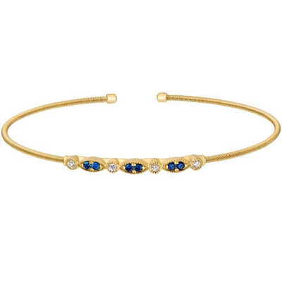 Gold Finish SS Cable Cuff Bracelet With Simulated Blue Sapphire And Simulated Diamond Marquis & Round Design