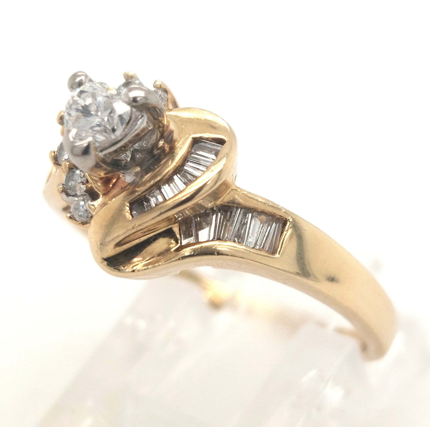 14K Yellow Gold Heart shape, RBC, & baguette diamond ring .50ctTW approximately, 4.0g size 7.25